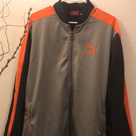 orange and black puma jacket